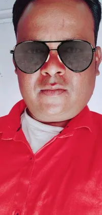 This phone live wallpaper features a man wearing sunglasses and a red shirt