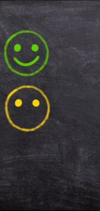 Get an animated phone live wallpaper featuring a blackboard with hand-drawn smiley faces