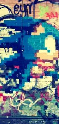 This lively phone wallpaper displays a blue fire hydrant against a graffiti-filled wall