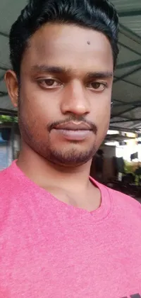 This live wallpaper showcases a close-up of a person in a pink shirt, without a helmet