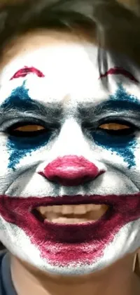 This phone live wallpaper showcases a Joker-inspired man with a colorful paint job close-up