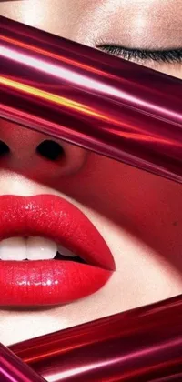 Download this phone live wallpaper featuring a captivating close-up shot of a model wearing bold red lipstick