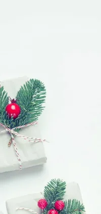 This live wallpaper for your phone features a festive scene, complete with a group of wrapped presents placed on a simple white table