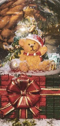 Transform your phone's screen with the Snow Globe Phone Live Wallpaper featuring a miniature bear inside a snow globe resting atop a snow-covered ground