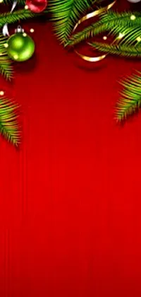 Experience the Christmas magic on your phone with this wallpaper that features Christmas tree branches on the top half on a red-colored background where you can organize your apps
