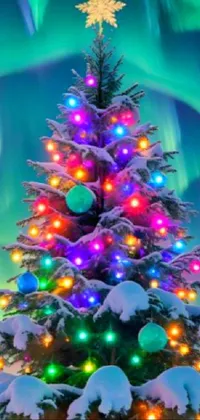 Enjoy Christmas with this wallpaper on your phone that features a Christmas tree with glowing lights and sparkling stars in the background