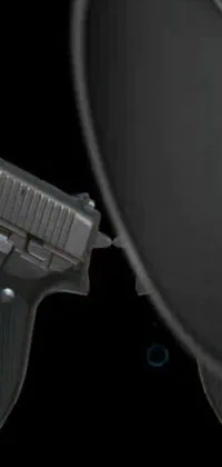 This live wallpaper features a close-up of a gun in front of a mirror, displaying exceptional detail and realism