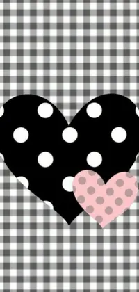 This live phone wallpaper features a playful heart design in polka dot pattern displayed over a contrasting black and white checkered background