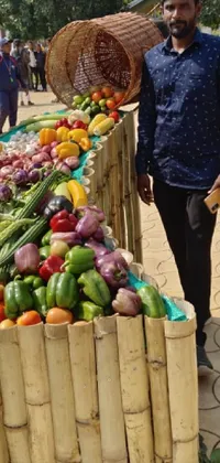 This stunning live wallpaper features a man standing beside an abundant pile of vibrant fruits and vegetables