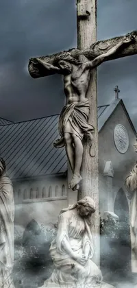 If you&#39;re looking for a phone wallpaper to add an air of gothic and religious symbolism, you&#39;ll love this stunning depiction of a group of statues of Jesus on a cross