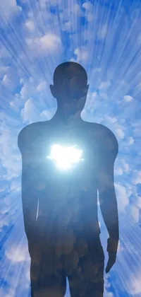 Get mesmerized with our phone live wallpaper featuring a man standing in front of a bright light, surrounded by light clouds, and a translucent body effect