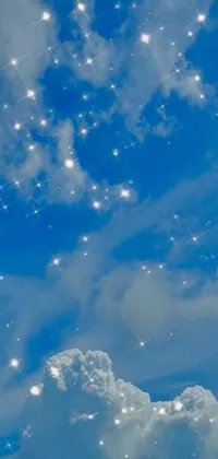 This vibrant live wallpaper features a stunning blue sky filled with countless white stars, dynamically twinkle and glow