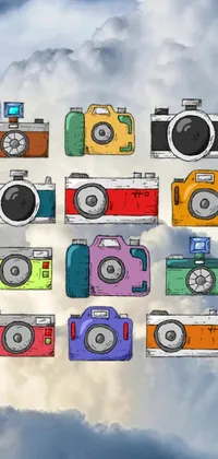 This phone live wallpaper features a group of colorful cameras in "Harry Volk" clip art style, with beginner-friendly digital 2D graphics and Kodakchrome-inspired colors