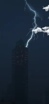 Add a spark of life to your phone with this stunning wallpaper image of a lightning bolt striking a tall building