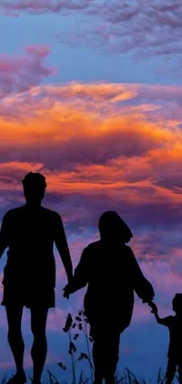 This stunning phone live wallpaper showcases a family silhouette set against a sunset sky in an original, colorful, and vibrant scene
