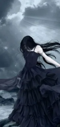 Looking for a dramatic phone wallpaper that exudes a gothic vibe? Check out this stunning live wallpaper featuring a woman in a black dress standing on rocks, her tears streaming down her face as she looks out to the stormy ocean