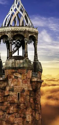 This phone live wallpaper features a stunning clock tower in a desert landscape, with organic-looking towers and a sky bridge in a mix of steampunk and fantasy art