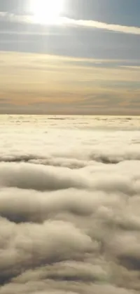This phone live wallpaper features a magnificent plane flying above layered stratocumulus clouds on a sunny day