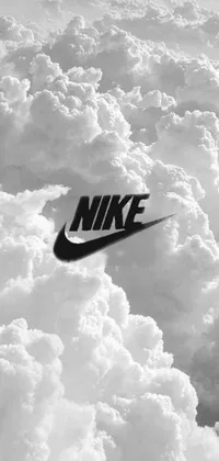 This sophisticated phone live wallpaper features a stunning black and white photograph of the iconic Nike logo amidst fluffy white clouds, creating a serene and dreamy aesthetic
