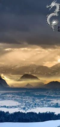 This phone live wallpaper features a breathtaking scene of sunlight shining through clouds over mountains