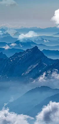 This phone live wallpaper depicts a stunning view of mountains and clouds from an airplane