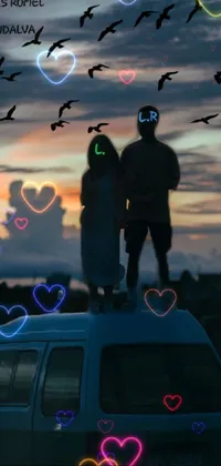Looking for a scenic and dreamy mobile wallpaper? Check out this magical realism-themed phone live wallpaper! It features a couple standing on a van while enjoying the warm, orange glow of the sunset