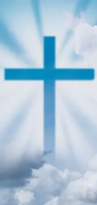 This mobile live wallpaper showcases a captivating blue cross set against a cloudy sky, with a light glare perfect for adding charm to your phone’s profile picture
