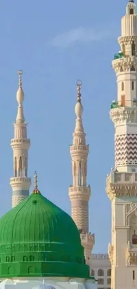 This stunning phone live wallpaper features a green and white building with a green dome and three towers