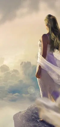 This digital phone wallpaper features a breathtaking image of a woman in a white dress standing atop a cliff