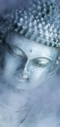 The phone live wallpaper shows a stunning close-up of a highly detailed Buddha statue with wisps of smoke emanating from it