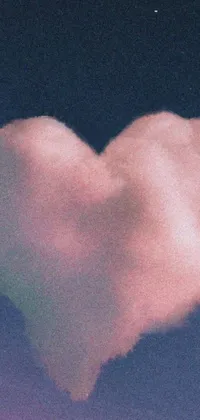 This live wallpaper for your phone showcases a heart-shaped cloud against a dark, starry sky