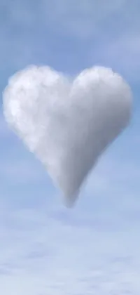 This lovely live wallpaper features a heart-shaped cloud floating in the sky