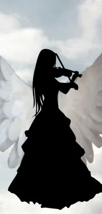 This phone live wallpaper features a beautiful silhouette of an angel playing a violin against a background of vibrant, oversaturated colors