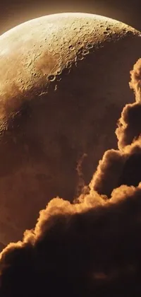 This live wallpaper showcases a beautiful, close-up view of a glowing moon surrounded by wispy clouds over a dark orange night sky