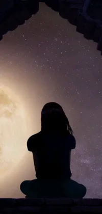 This phone live wallpaper features an awe-inspiring digital artwork of a woman compelled by a yellowish full moon shining through a portal
