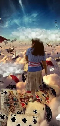 This surreal phone live wallpaper features a woman perched atop a stack of floating cards, surrounded by a dreamlike atmosphere