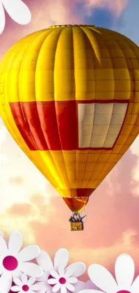 Get a stunning live wallpaper for your phone with a beautiful hot air balloon flying high in a cloudy sky