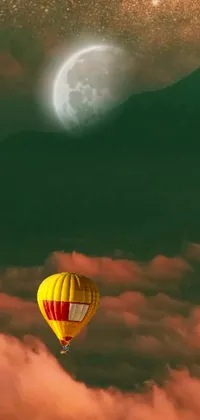 This phone live wallpaper features a serene scene of a hot air balloon floating amidst a yellow-green smog sky with a full moon in the background