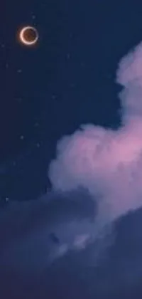 Enjoy a serene and calming phone screen with our dreamy night sky live wallpaper depicting fluffy clouds drifting peacefully