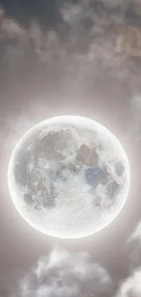 This live phone wallpaper features an ethereal full moon in moonlight grey with a circular white shape and visible craters