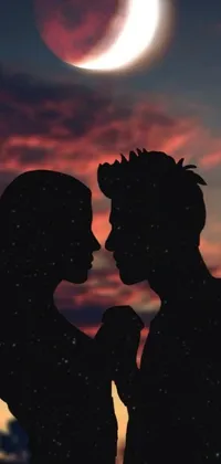This live wallpaper showcases a stunning silhouette of a couple sharing a romantic kiss in front of a luminous moon