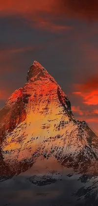 This stunning live wallpaper features a majestic mountain with a vibrant red sky in the background, perfectly captured by an acclaimed photographer