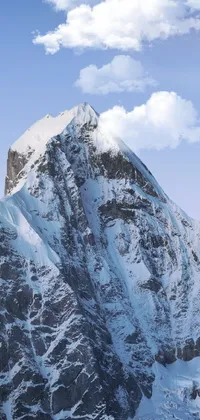 This astonishing phone live wallpaper features a man snowboarding on a snow-covered mountain, hyperrealism, and an aerial view of the majestic peaks
