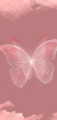 Decorate your phone with this stunning live wallpaper featuring a pink butterfly in flight against a misty, cloudy sky