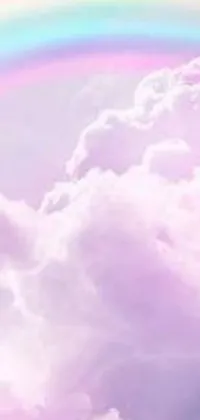 Looking for a captivating phone live wallpaper? Look no further than this stunning digital rendering that displays a rainbow in the sky above the clouds