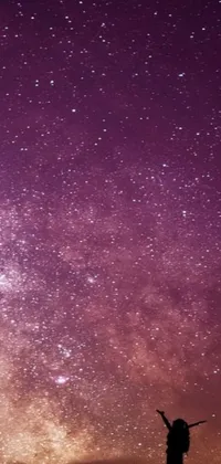 Transform your iPhone with this stunning live wallpaper featuring a mesmerizing sky full of stars