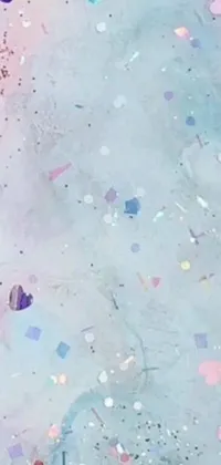 Get lost in a dreamy cellphone wallpaper featuring a vibrant confetti-covered table