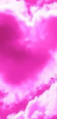 Experience the beauty of a pink heart-shaped cloud in the sky with this stunning live wallpaper