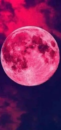 This lively and fascinating phone live wallpaper showcases a pink full moon shining brightly against a backdrop of clouds
