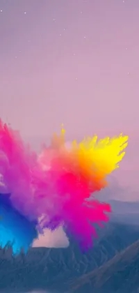 This live wallpaper for your phone features a colorful powder cloud against a backdrop of mountains
